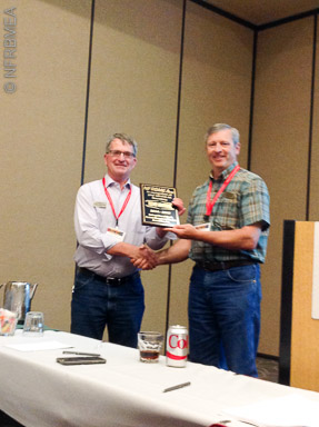 President David Gillman (UT) presents Secretary Rodney Armstrong, left, (ND) with his retiring officer plaque.